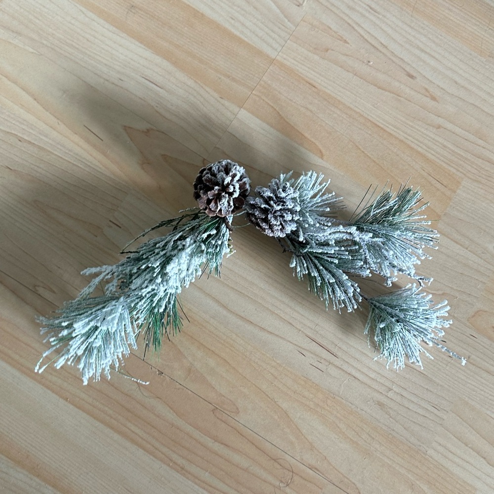 Two flocked pine picks